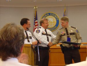 Deputy Dustin Reichert receiving purple heart award after being shot twice.