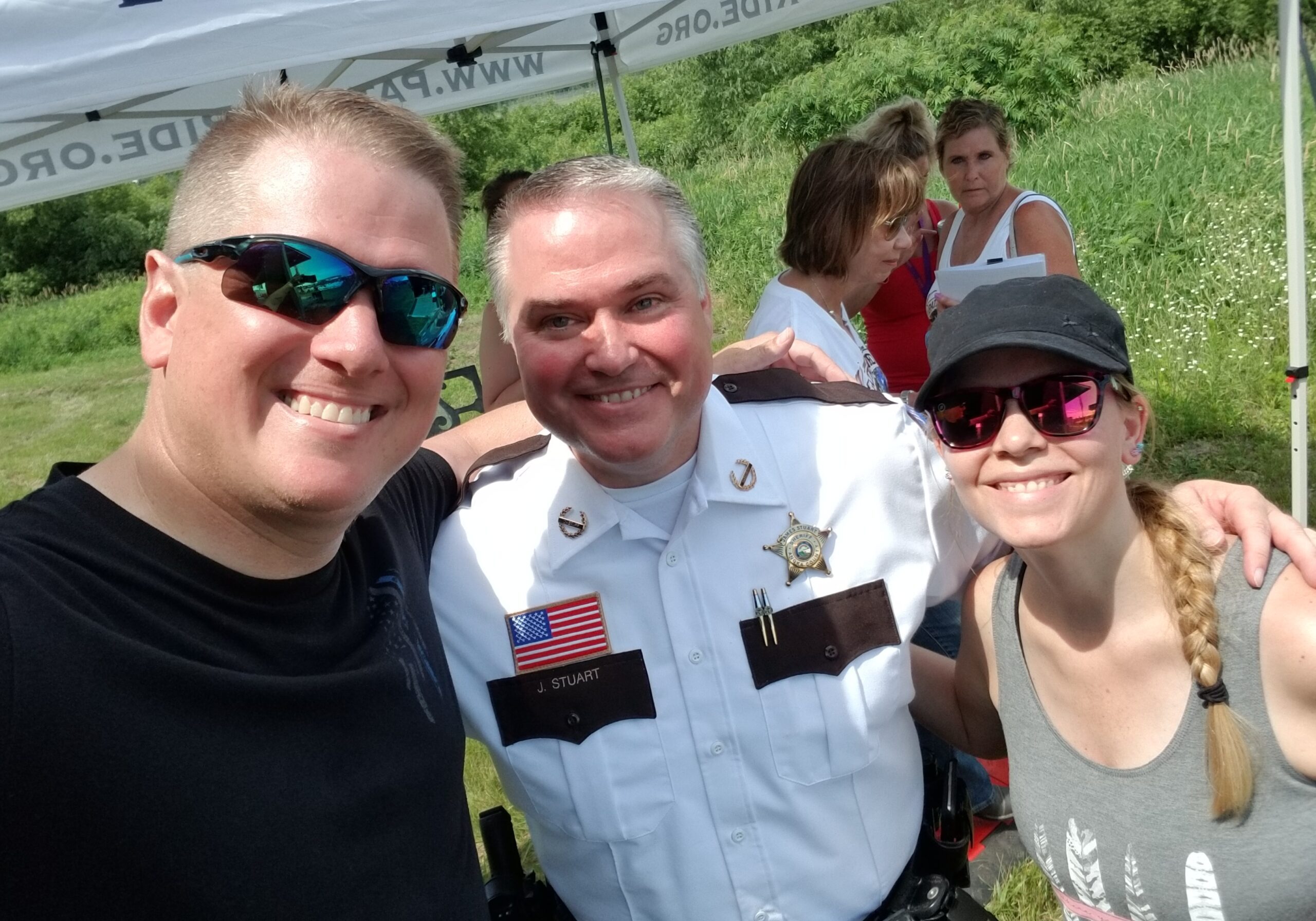 Dustin Reichert and wife with Sheriff James Stuart Anoka co Sheriff (ret) & MSA Executive Director at fundraiser.