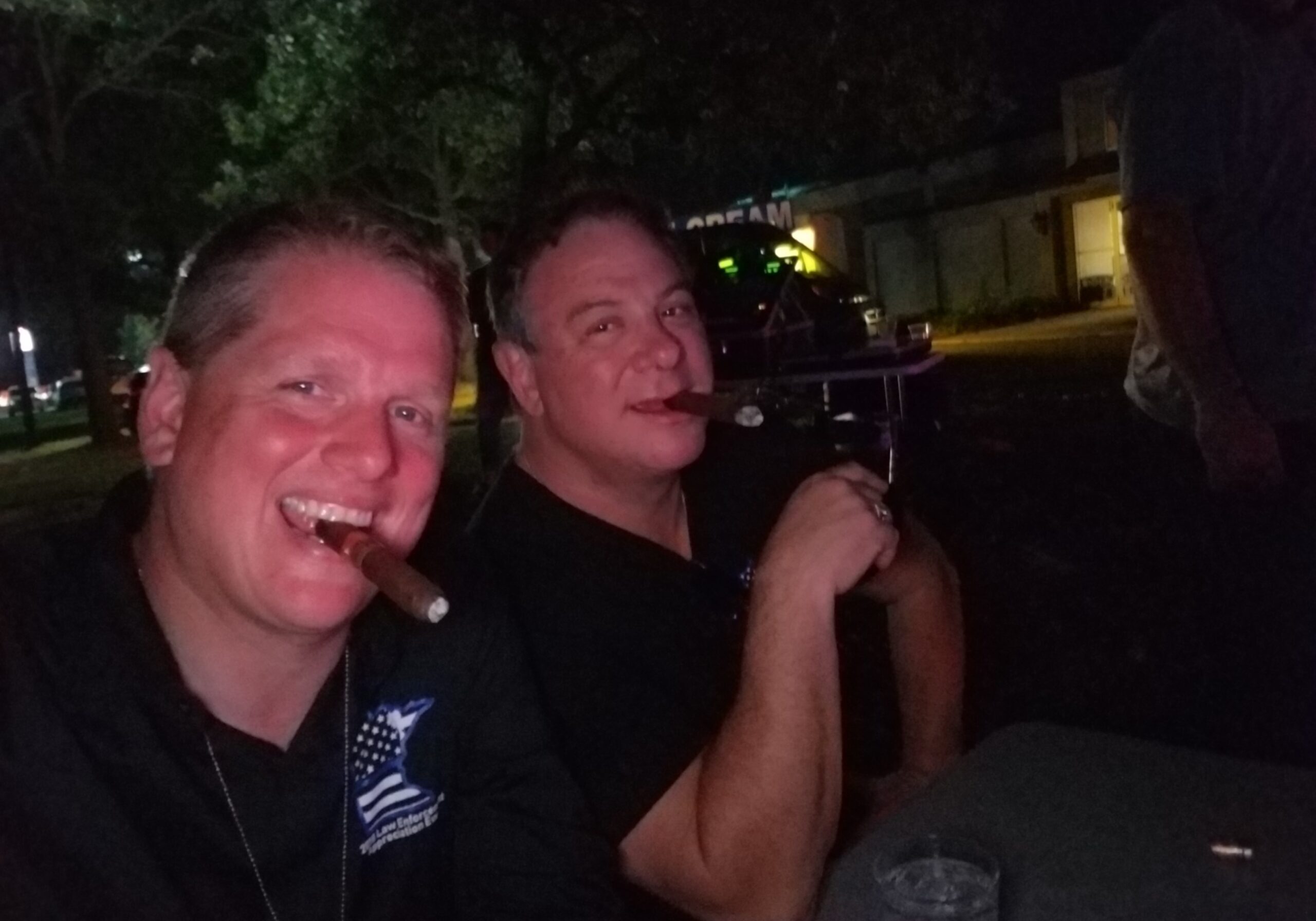 Dustin Reichert and Randy Sutton of Wounded Blue enjoying cigar after a fundraising event.